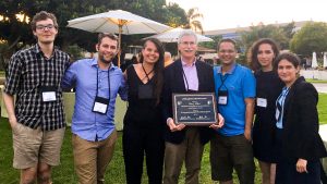 Eric Miller is flanked by a well-wishing UTTRI contingent at IATBR as he displays his Lifetime Achievement Award plaque