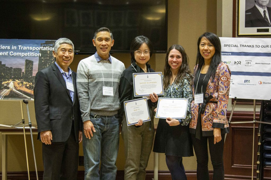 five pose with certificates