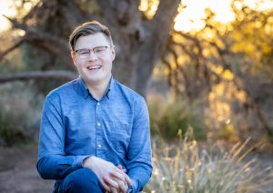 Brenden Lavoie sits outdoors