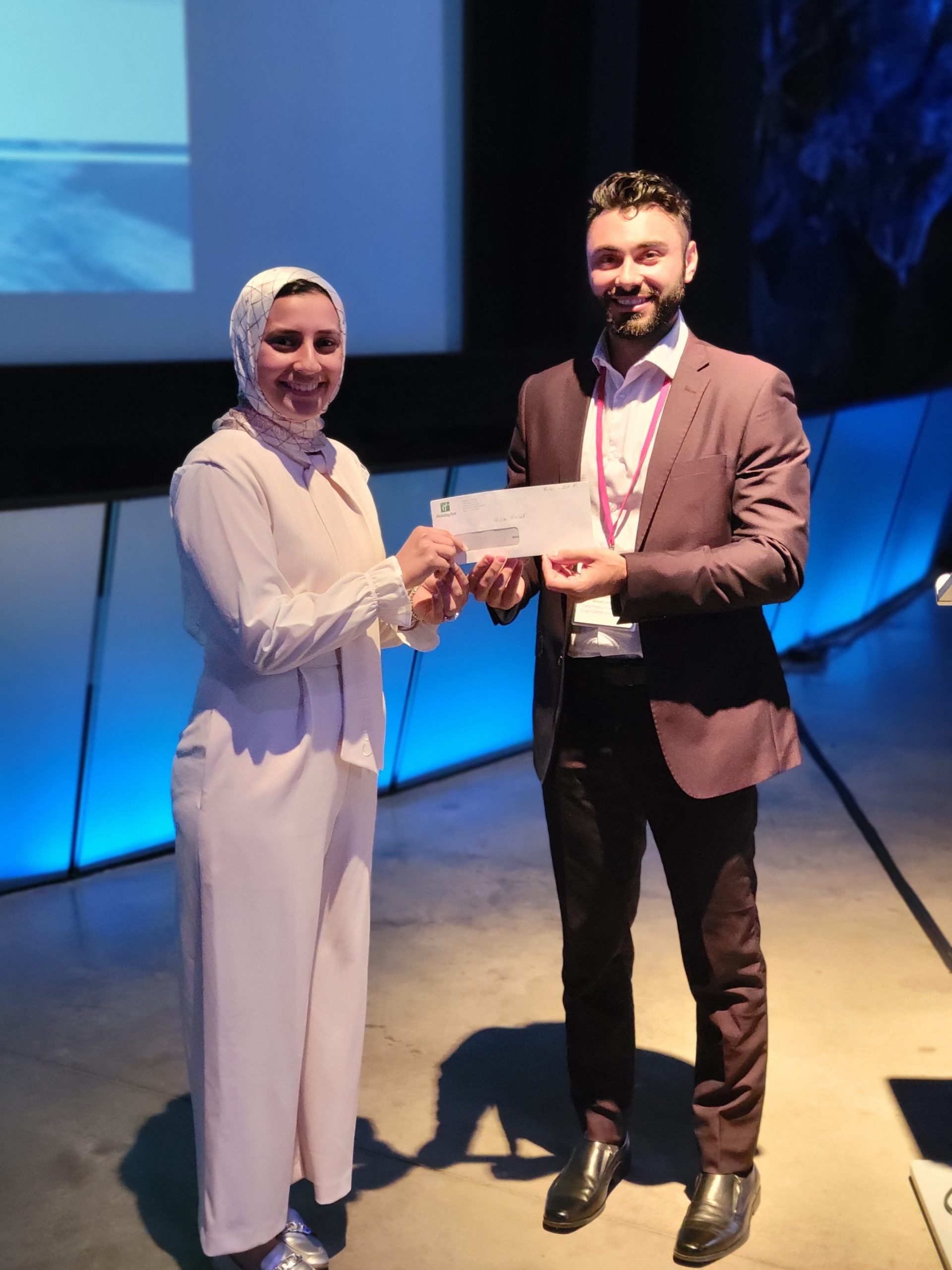 award envelope presented to winner on stage