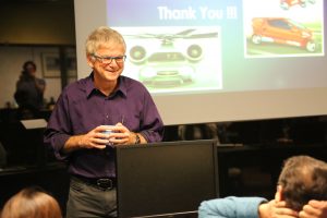 Speaker listening to audience member question