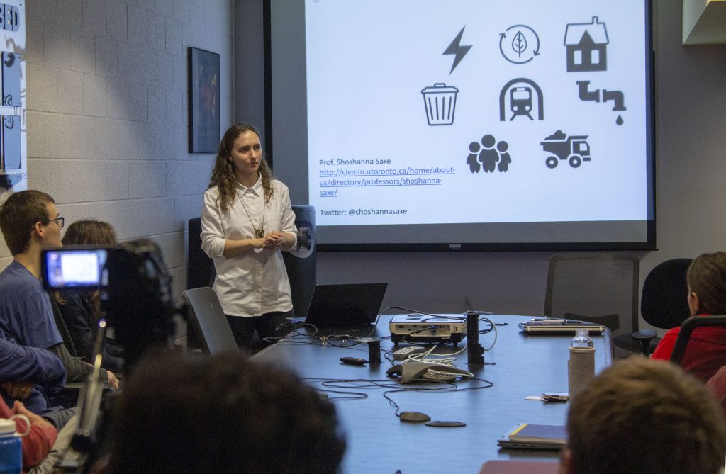lecturer listens to audience question