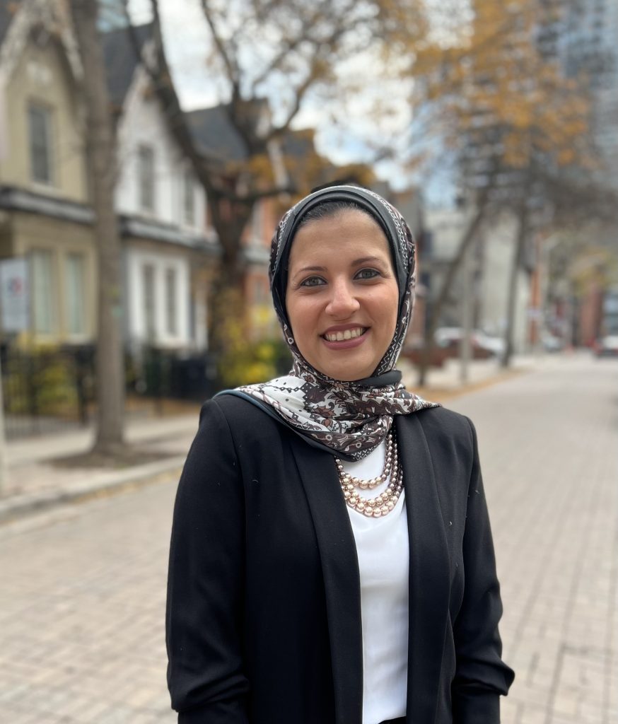 Lina Elmorshedy stands on a residential street