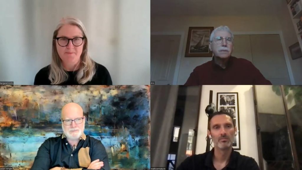 Screen capture of four speakers in discussion on Zoom